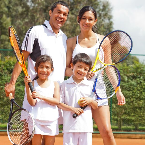 family with tennis racquets