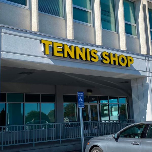 storefront with TENNIS SHOP sign