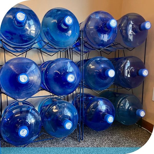 Stack of empty 5-gallon water jugs