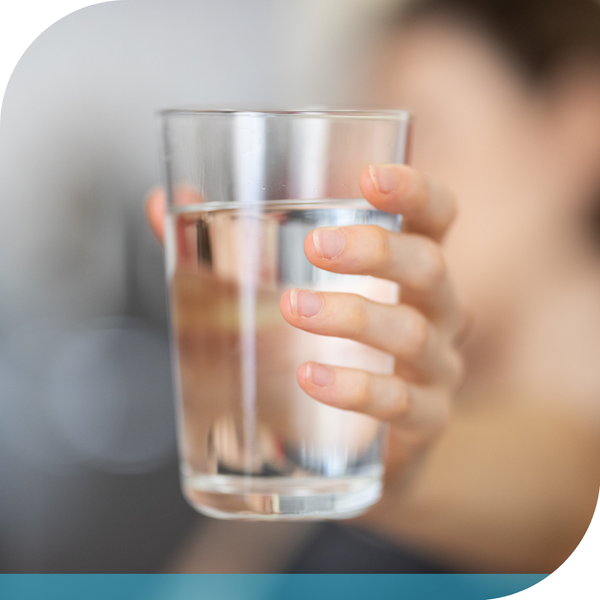 holding a glass of water