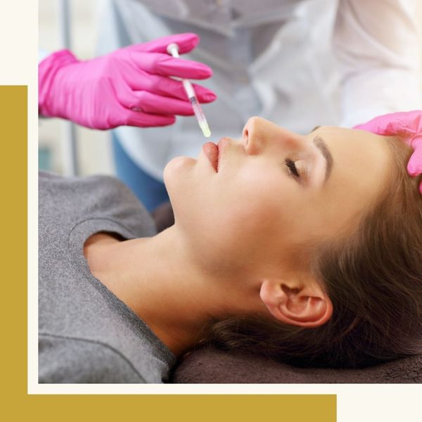 injecting small needle into patient's cheek/chin