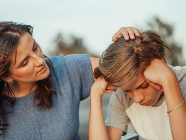 Mother comforting adolescent son. Affirming Learning Disorder Testing at Whole Child Neuro in Encino, CA