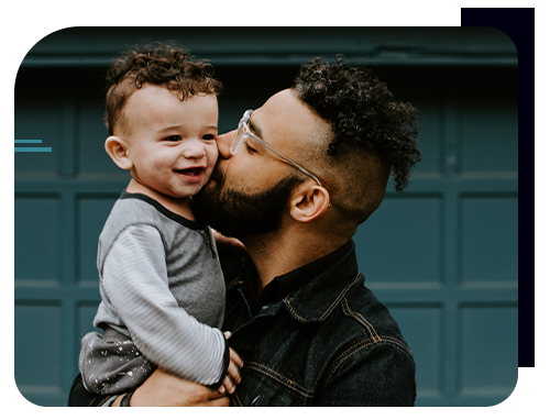 Man kissing child on the cheek