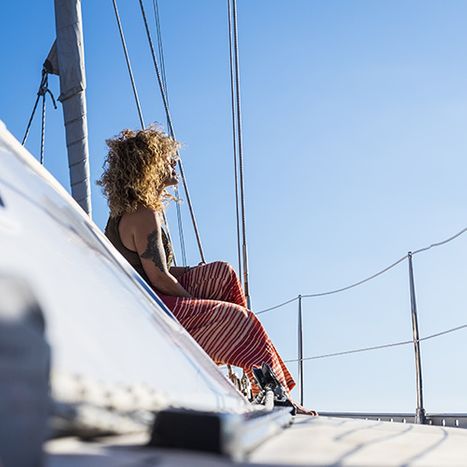 Woman on a boat enjoying sunshine
