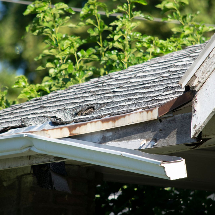 roof and gutters damaged from a storm