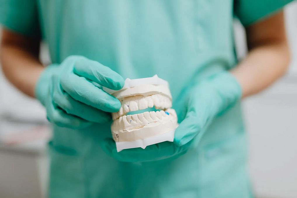dentist holding implants