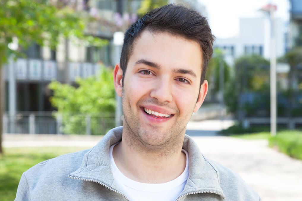 man smiling outdoors