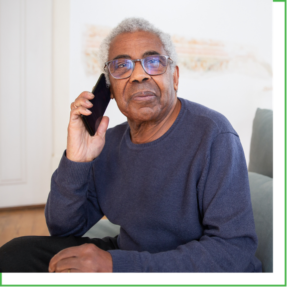 older man talking on phone