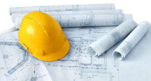 Architectural plans and hard hat