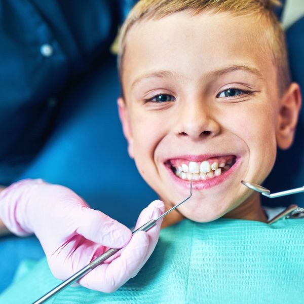smiling kid at dentist