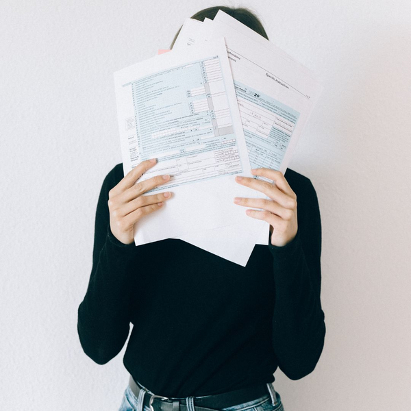 woman holding tax papers