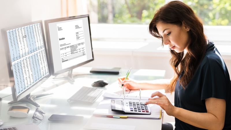 Image of a woman doing accounting services