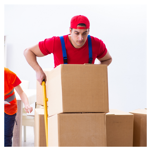 movers pushing a stack of boxes on a dolly. 