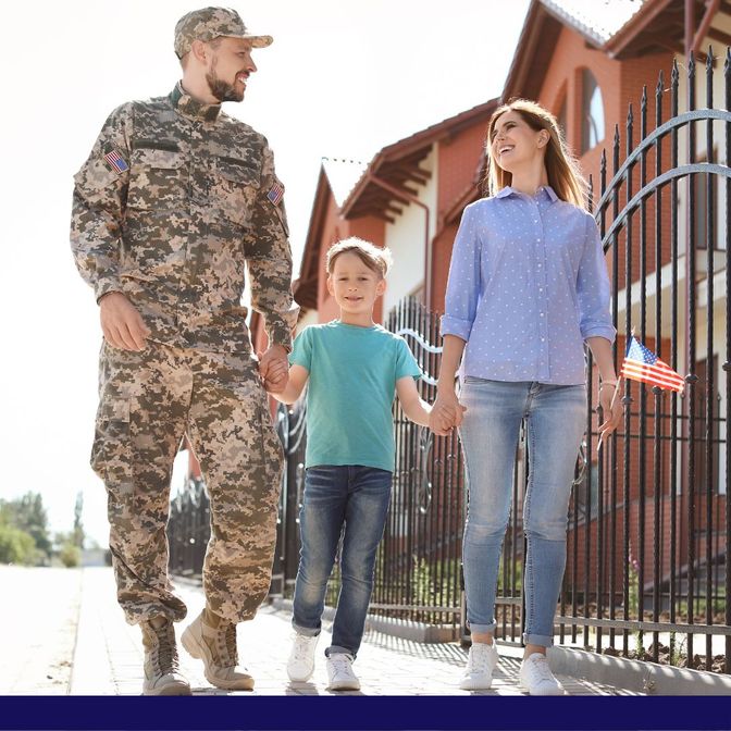 Military father, son and wife walking outside their new house