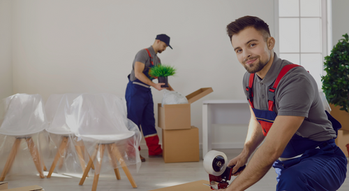 professional movers packing boxes. 