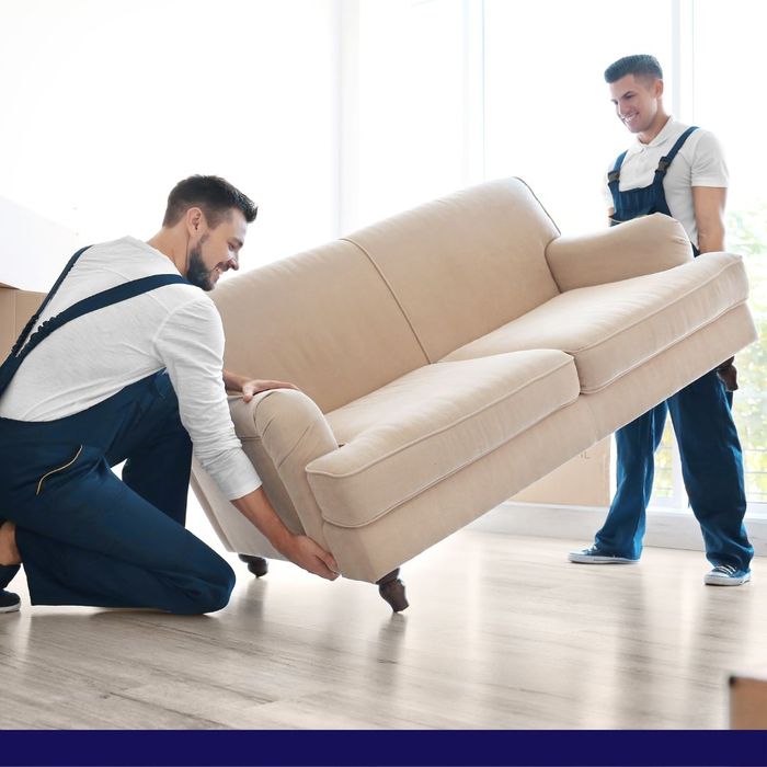 2 movers lifting a couch 