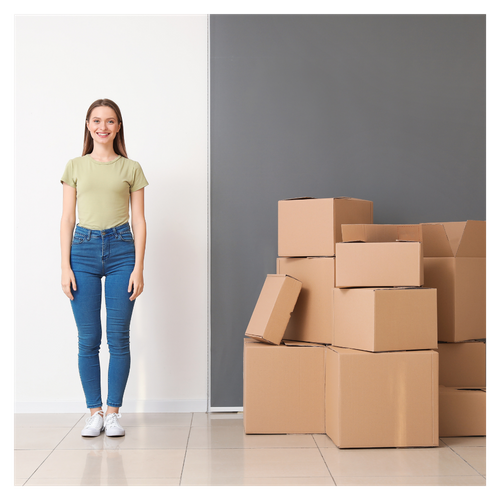 woman standing next to a stack of boxes. 