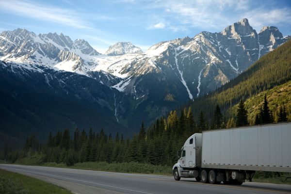 moving truck driving through mountains