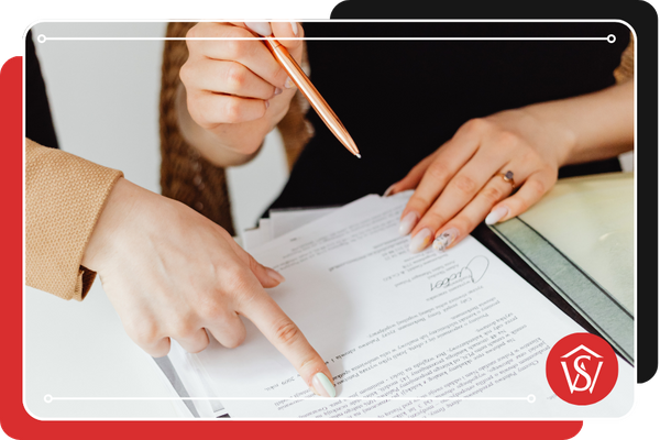 people looking at real estate paperwork