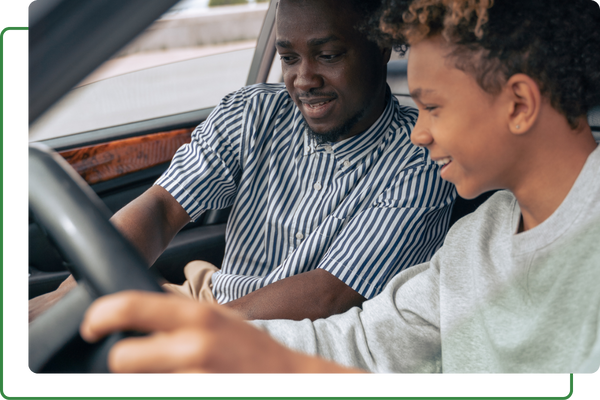 A child and father driving