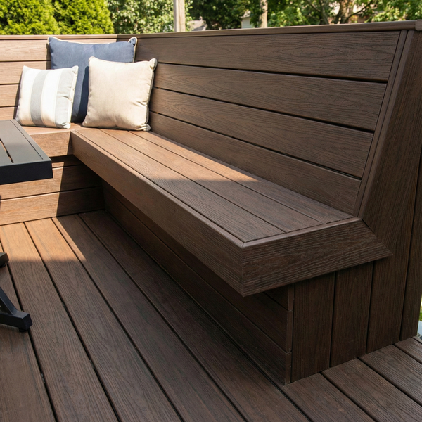 A built-in composite bench on a custom deck provides seamless and functional seating.