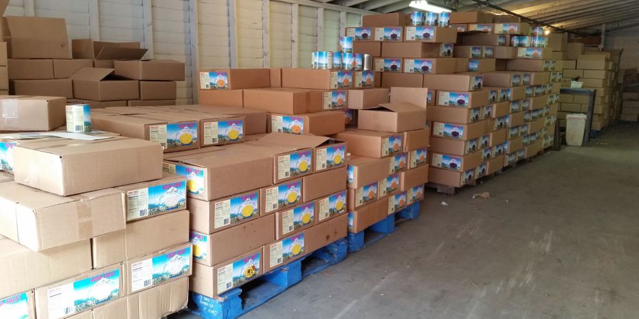 Various boxes on wood pallets in a warehouse