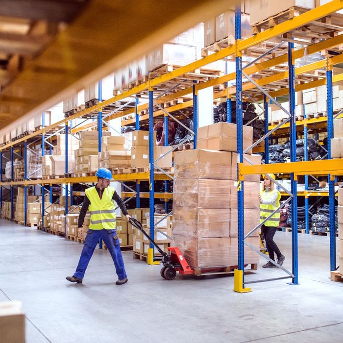 moving custom pallet loaded with products in warehouse