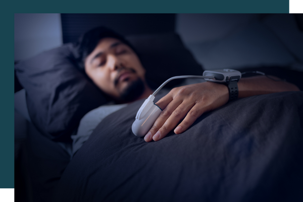 man sleeping with finger monitor