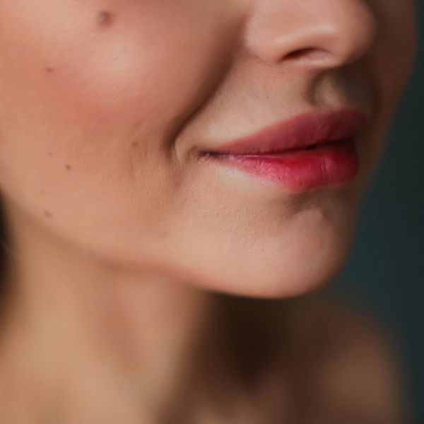 Close-up of a lady smirking Close-up of a lady smirking