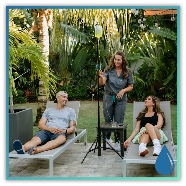 a SWFL Health and Hydration nurse hanging an IV for a couple in their backyard