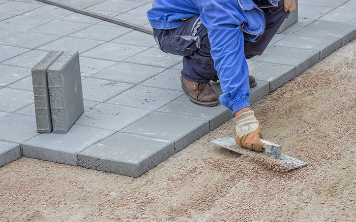 image of a man installing pavers