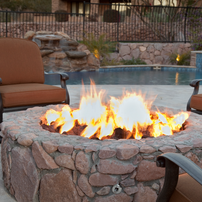 EMBRACE COZY EVENINGS WITH AN OUTDOOR FIREPLACE.
