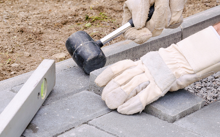 image of a man installing pavers