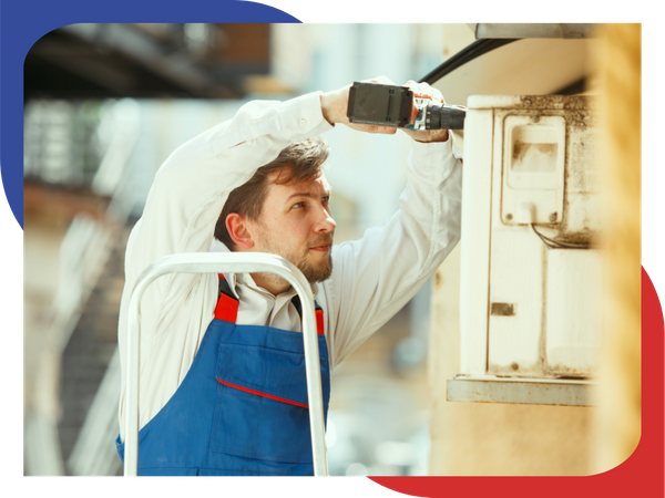 HVAC tech unscrewing