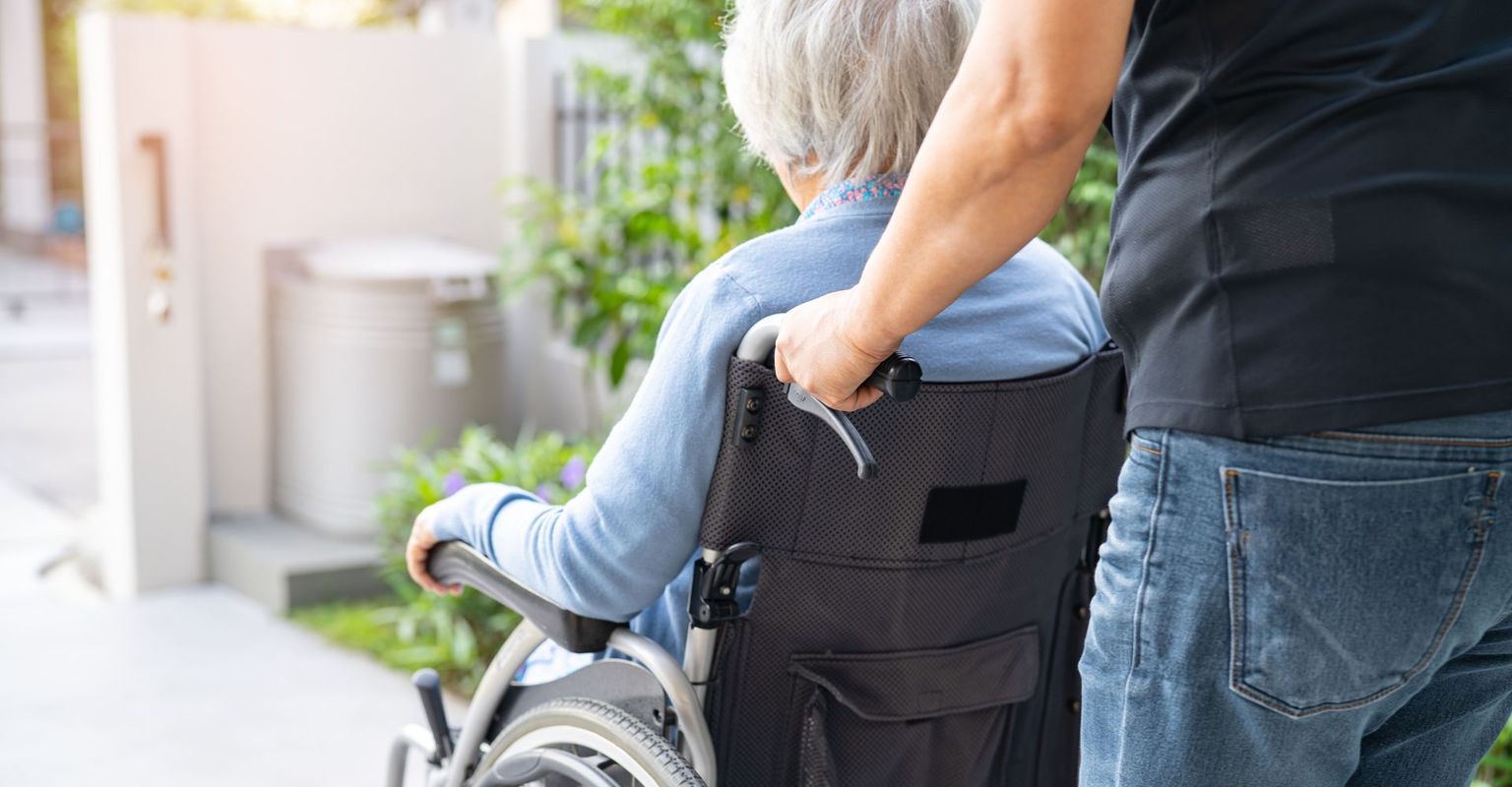 Elderly care nurse and patient.