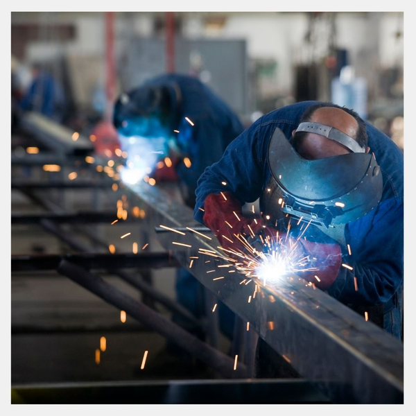 Two welders working