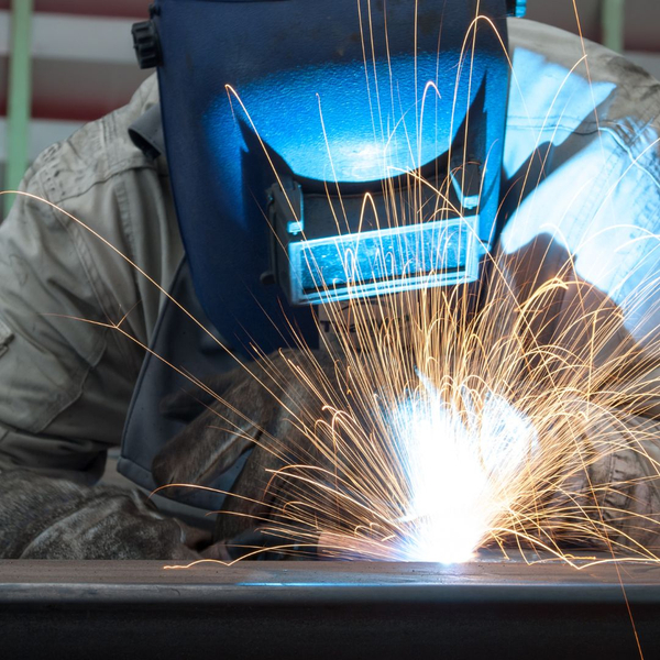 Sparks flying while someone is welding