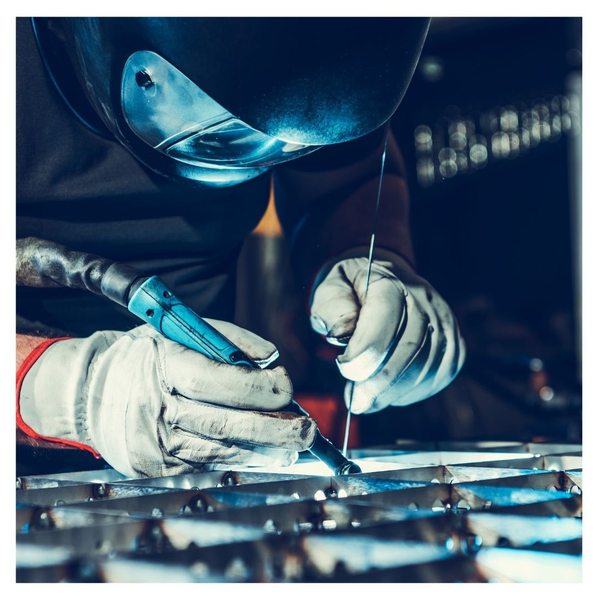 A welder compelting a weld