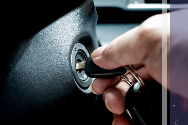 person trying to start their car