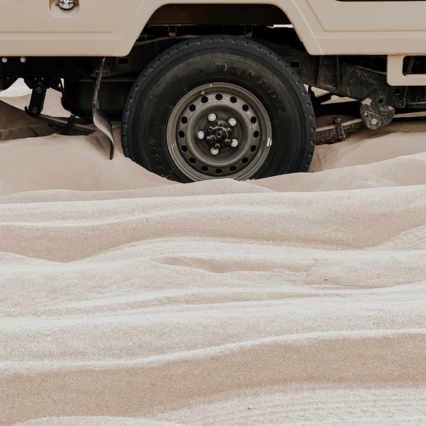 vehicle stuck in sand. 