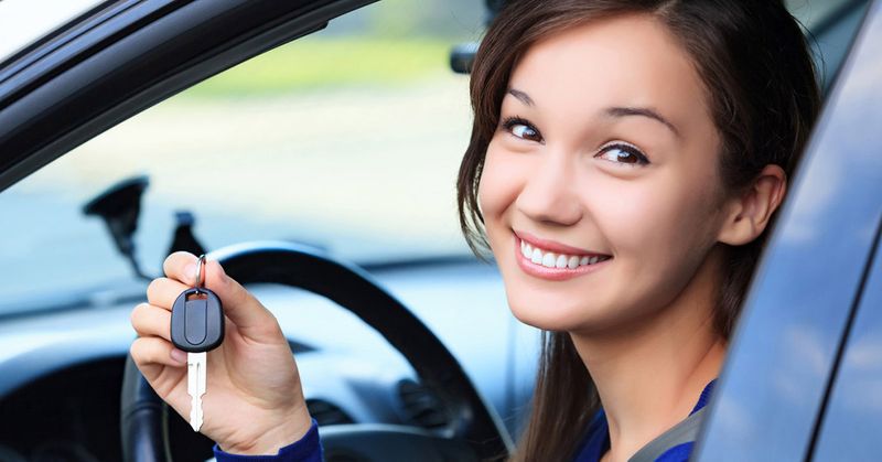Image of a girl with a car key
