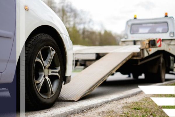 vehicle being loaded onto tow truck vehicle being loaded onto tow truck