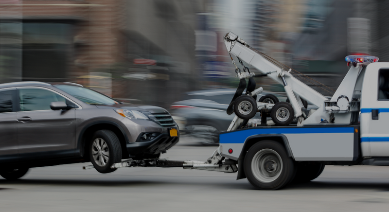 car on a tow truck. 