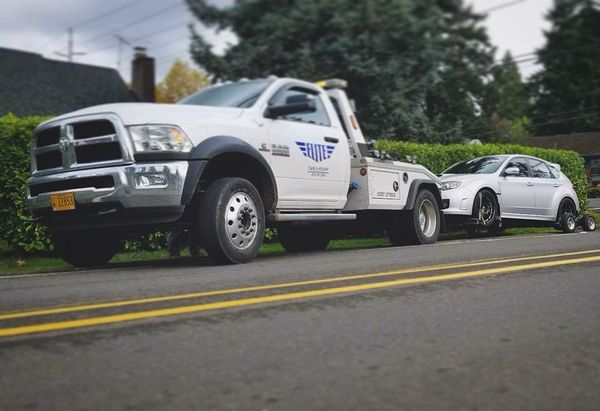 Image of a truck towing a car