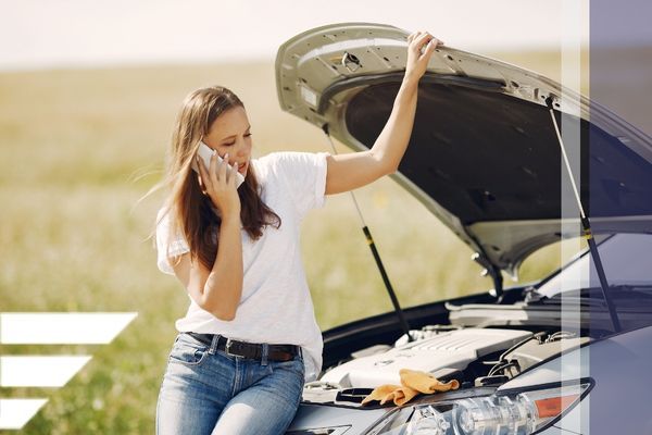 woman calling for roadside assistance woman calling for roadside assistance