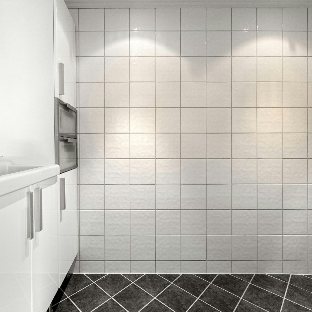 bathroom with both white and black tile