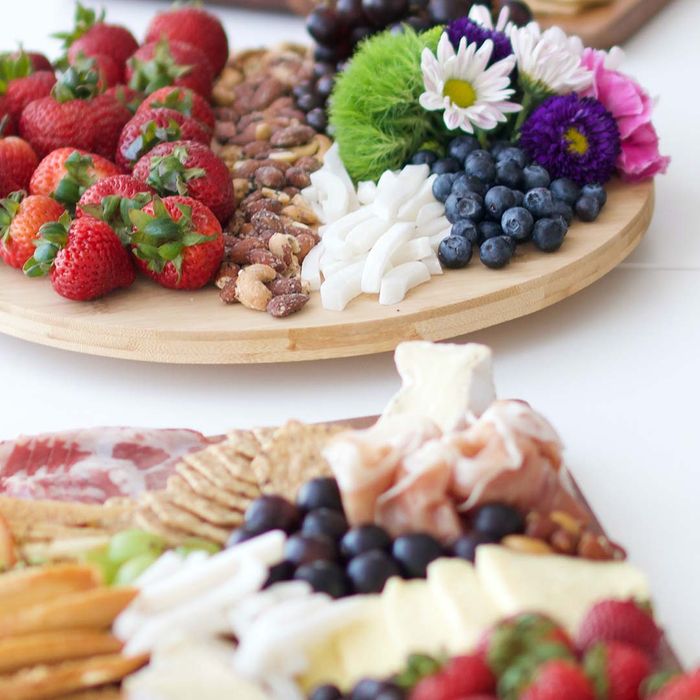 Three Charcuterie Boards with flowers on them