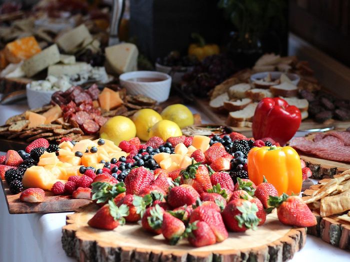 charcuterie boards filled with fruits and vegetables