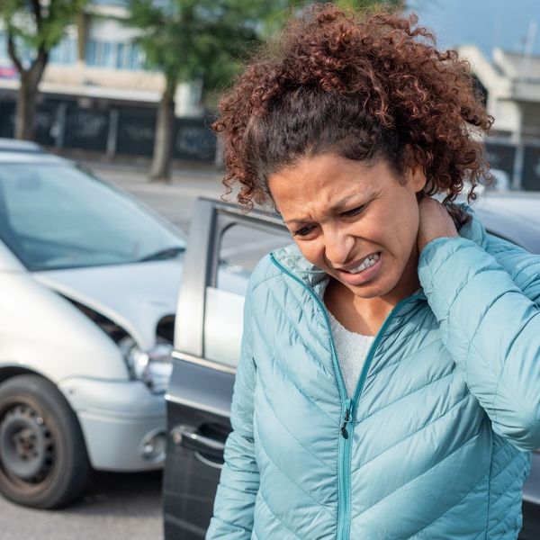 a woman in pain from a car accident