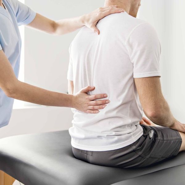 man receiving chiropractic care for neck and back